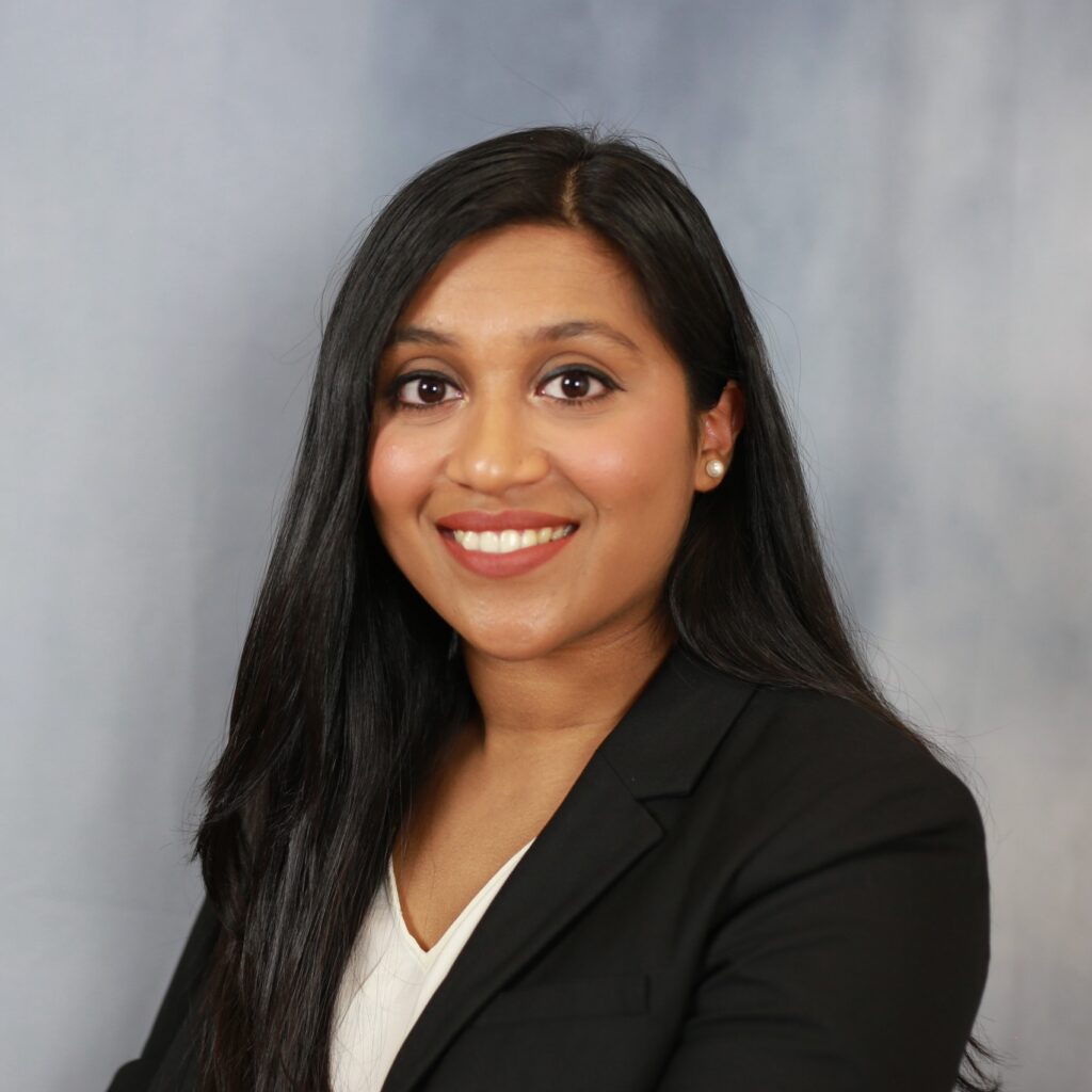 Photo of Dr. Masub in a black blazer and white blouse